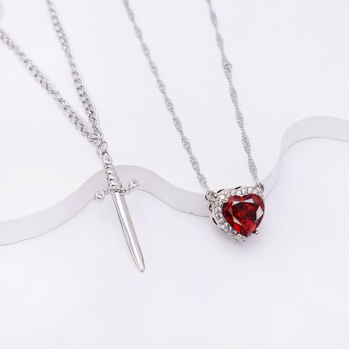 A romantic heart and sword necklace set, perfect for couples and best friends.