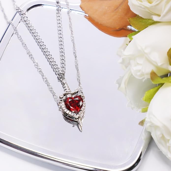 A romantic heart and sword necklace set, perfect for couples and best friends.